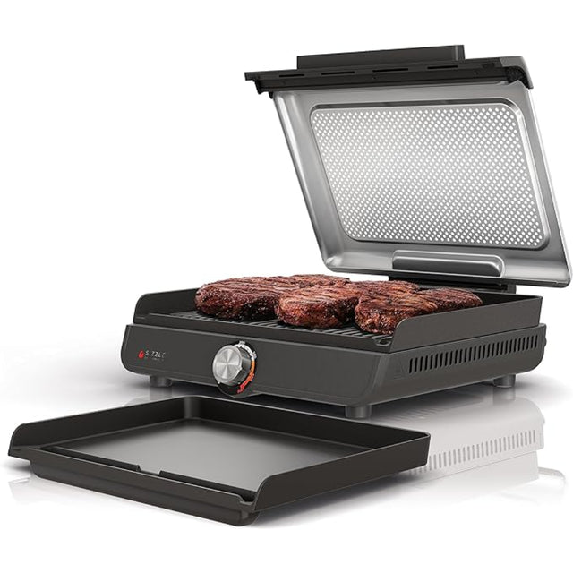 Imagen de la Ninja Sizzle™ Indoor Grill & Griddle, con placas intercambiables de 14 pulgadas, material antiadherente y control de temperatura de 325°F a 500°F. Ideal para asar, dorar y cocinar carnes, pancakes y más, con bajo nivel de humo y fácil limpieza.